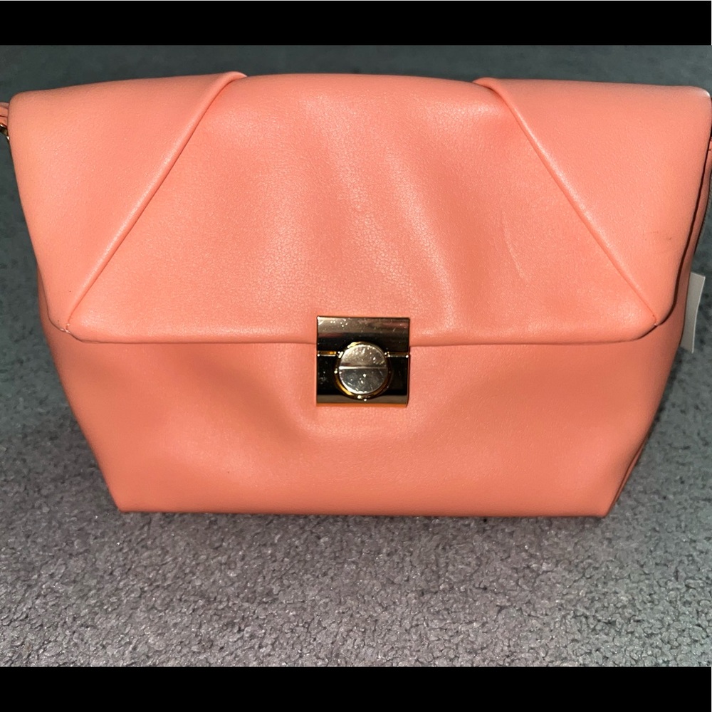 This is a nice little purse with a nice strap, it’s not used at all